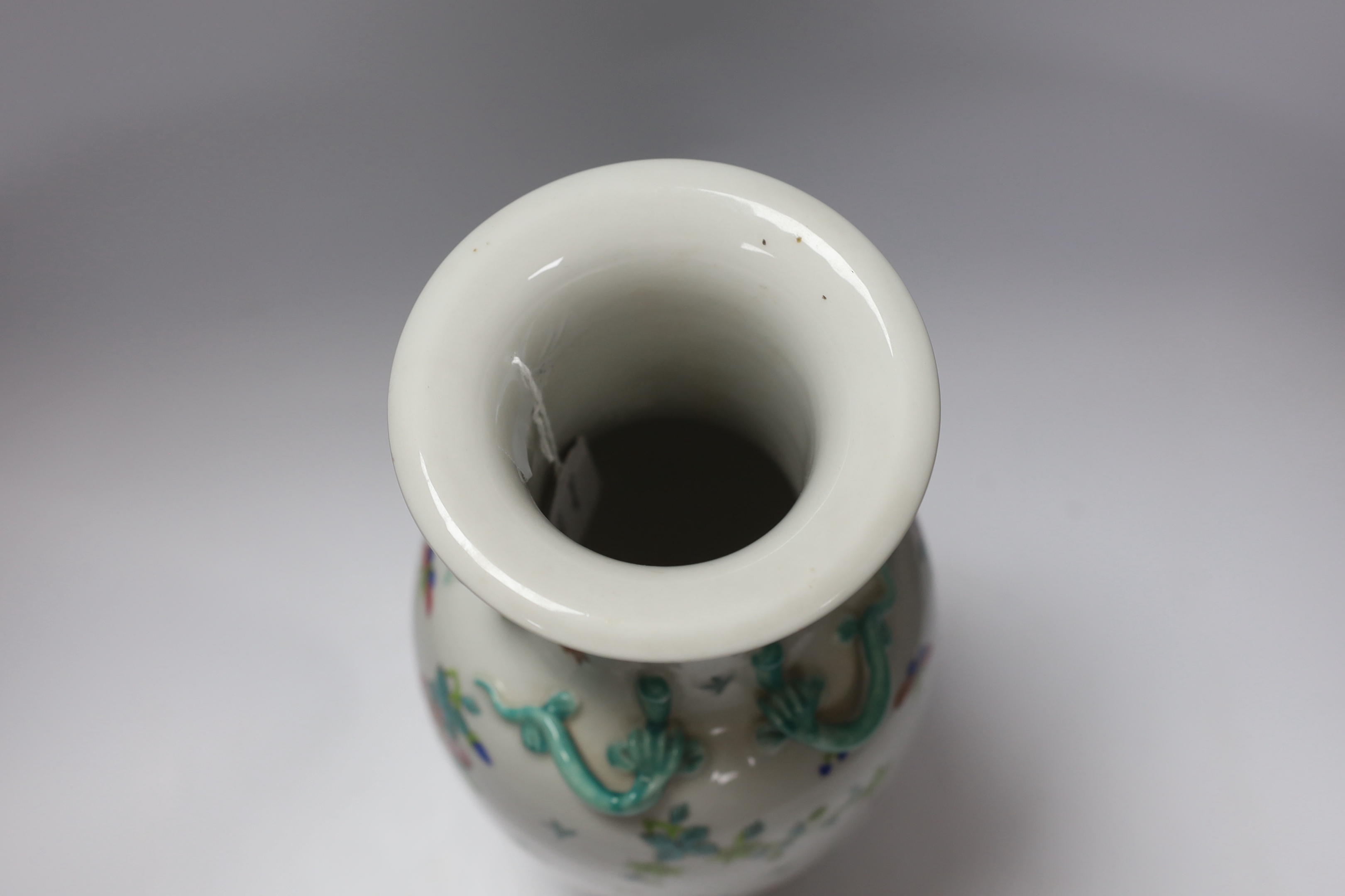 A Chinese famille rose vase, 20th century, with a drilled base, intended to be converted to a lamp, 36cm high